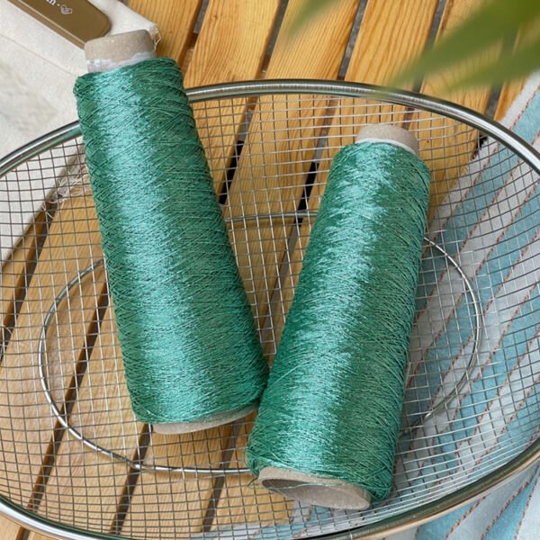 Shiny silver and gold yarn woven INS thread