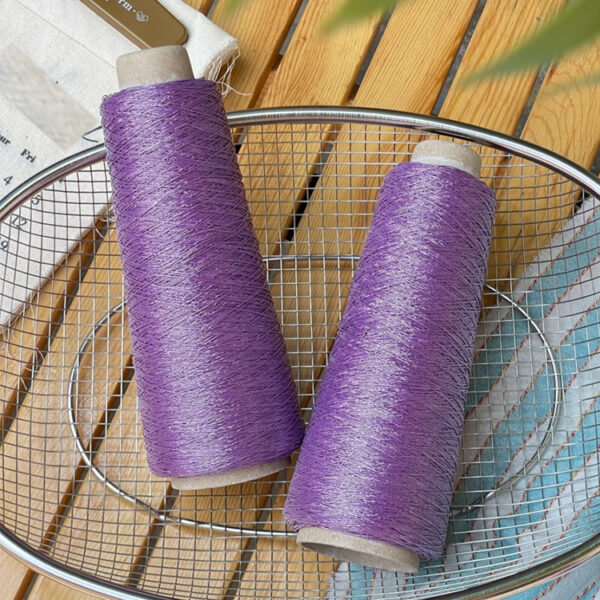 Shiny silver and gold yarn woven INS thread