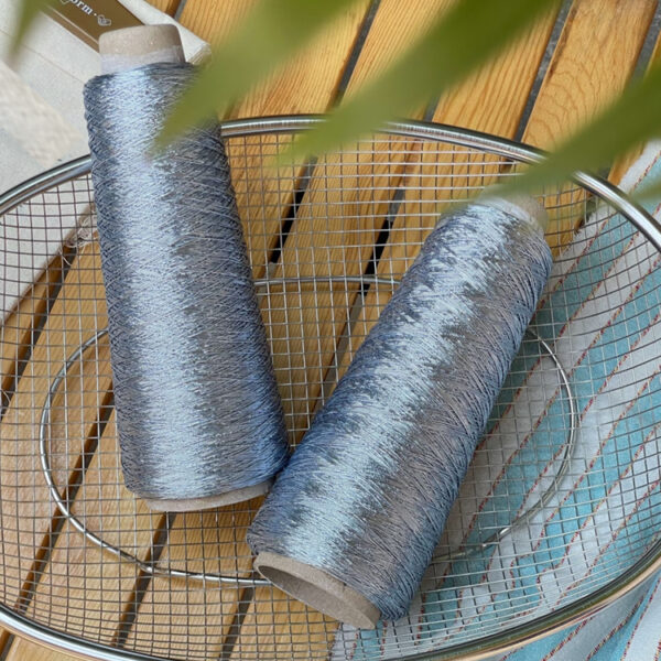 Shiny silver and gold yarn woven INS thread