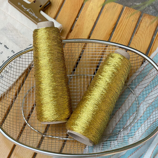 Shiny silver and gold yarn woven INS thread